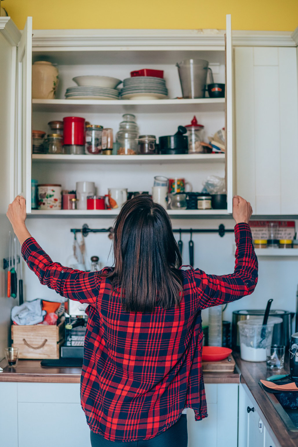 Housewife organizing the kitchen.