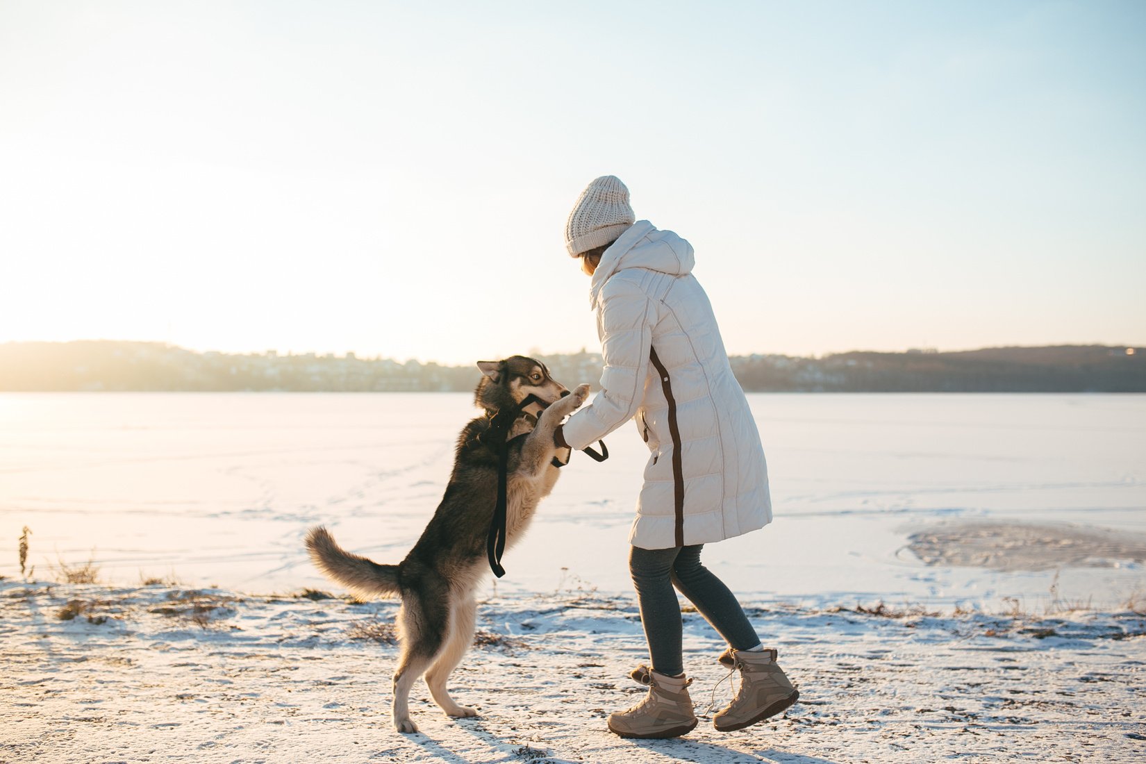 Woman with Pet Dog in Winter